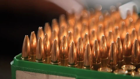 A man loading bullets Video stock 88471808