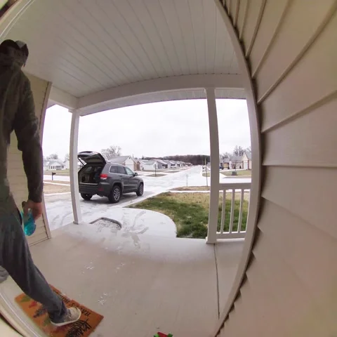 Man Loading Car Slips on Ice in Hard Fall, Defiance, Ohio, USA - 02 Jan 2022 Stock Footage 205414924