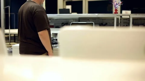 Man loading clothes into washer slider shot Stock Footage 7909721