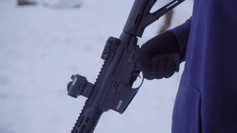 man loading gun to aim | Stock Video | Pond5