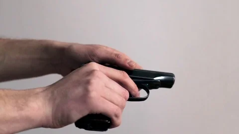 Man loading a real gun Video stock 74415907