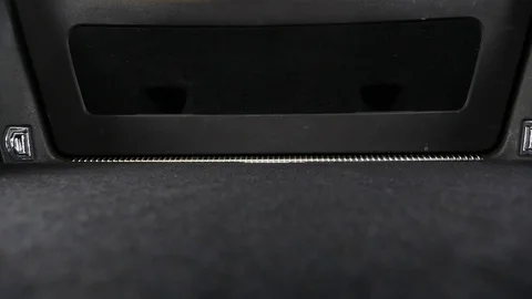 A man loading suitcases into a car Stock Footage 77689104
