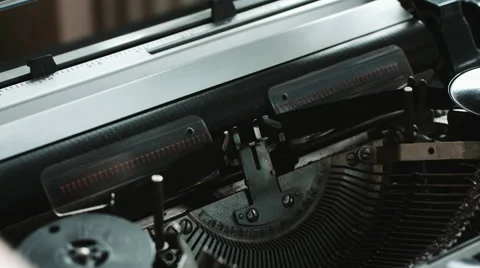 Man loads a blank sheet of paper in the typewriter Stock Footage 69070141