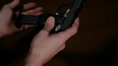 Man Loads Gun 2 Stock Footage 103068507