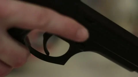 Man loads a handgun 스톡 동영상 45669579