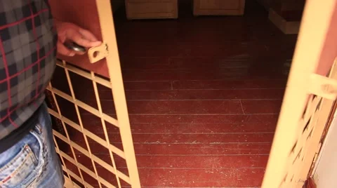 Man is locking cell jail door in the jail for the prisoners Stock Footage 49642728