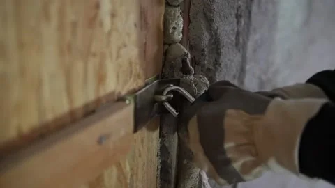 Man locking doors with padlock Stock Footage 161164673