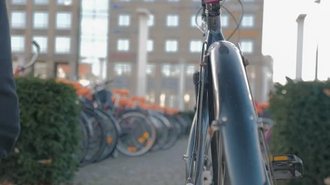 Man locking his bike Stock Footage 98363445