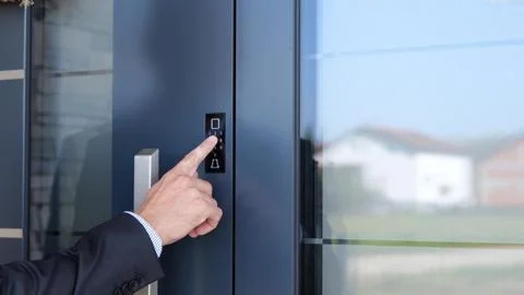 Man Locking Main Door With Password Before Leaving Smart Home. Stock Photos