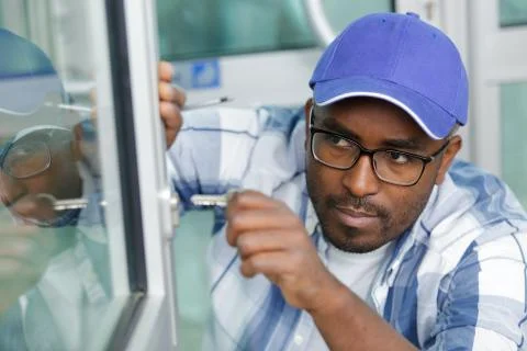 Man locking or opening a double glazing window Stock Photos