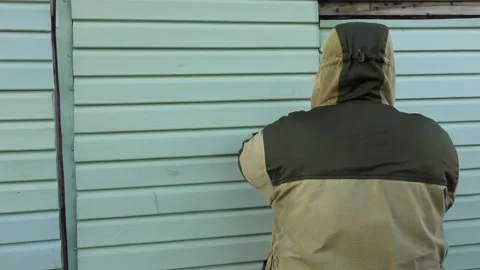 Man locks the barn Stock Footage 139134865