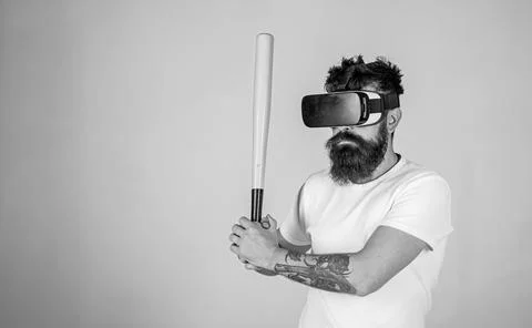 Man with long beard concentrated on virtual reality game. Bearded man in VR Stock Photos