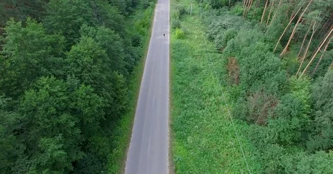 Man in the long-distance race with two jerrycans in hands Stock Footage 80440143