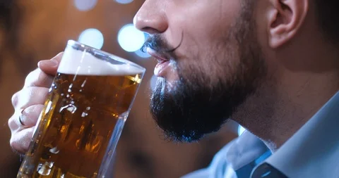 Man with a long twisted mustache, drinking beer Vídeo Stock 127090886