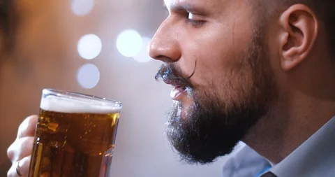 Man with a long twisted mustache, drinking beer 스톡 동영상 127090905
