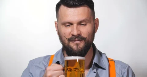 Man with a long twisted mustache, drinking beer 库存影片 127091046