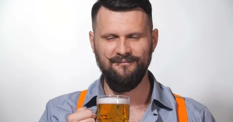 Man with a long twisted mustache, drinking beer 스톡 동영상 127091196