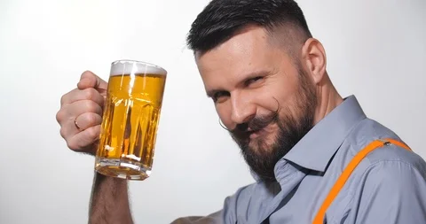 Man with a long twisted mustache, drinking beer 動画素材 127091391