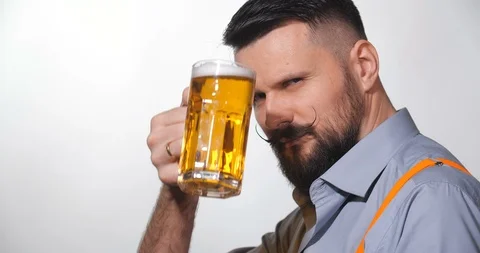 Man with a long twisted mustache, drinking beer 库存影片 127091713