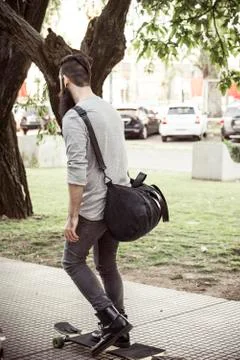 Man longboarding on sidewalk 스톡 사진