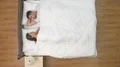 The man look to the beautiful woman in the bed. view from above 4k or 4k+ Resolution