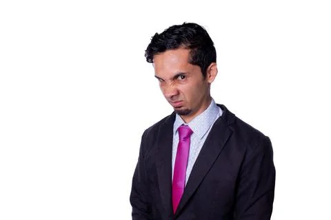 Man with a look of contempt looks at the camera with disgust. Businessman making Stock Photos