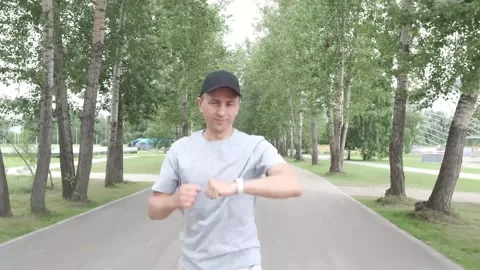Man look at smart watch during running training  Stock-Footage 245404291