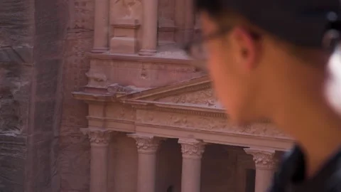 Man look into The Treasury ancient building in Petra Jordan. Close up shot. Stock Footage 167811784