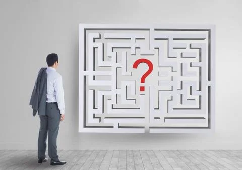 Man looking to a 3d maze on the wall Foto stock