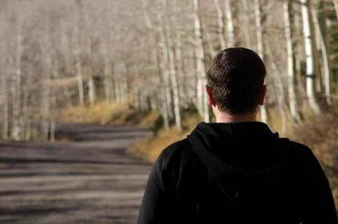Man looking ahead to the path in front of him. Stock Photos