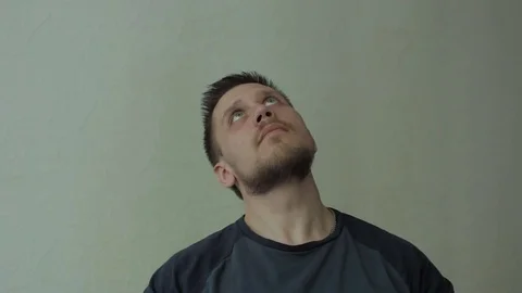 Man looking up and thinking. Video stock 77325125