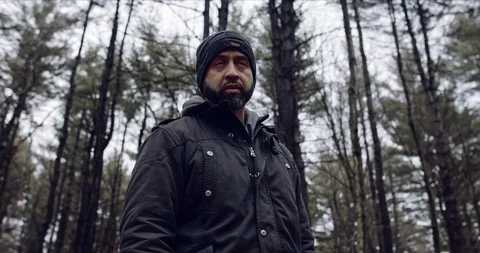 A Man Looking Around a Forrest Stock Footage 124700570