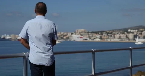 Man Looking Around at Panoramic Scene Date Waiting Family Majestic Seashore View Stock Footage 77020301