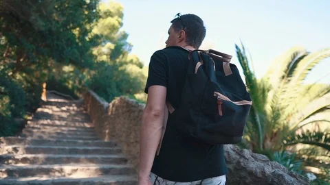 Man looking around in a Park Guell on vacation. Stock Footage 104723736