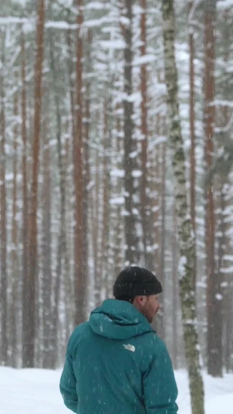 Man Looking Around in Snowy Forest Stock-Footage 320803509