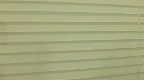 Man looking around through blinds 스톡 동영상 773354