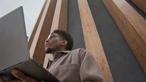 Man Looking Around while Using Laptop Stock Footage 320006110