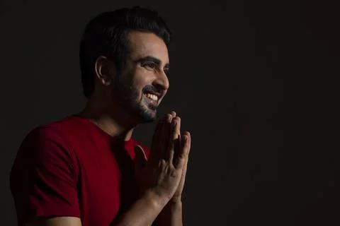 A MAN LOOKING AWAY WHILE LAUGHING Stock Photos
