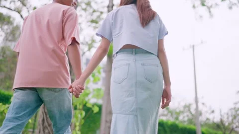 Man looking back, trusting, holding hands, enjoying, relaxing, walking, forward  Stock Footage 265229417