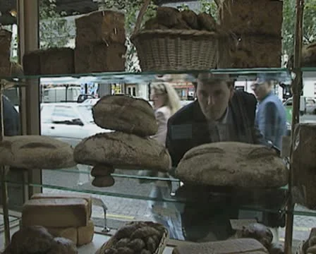 Man looking at bakery shop display Stock Footage 8919720