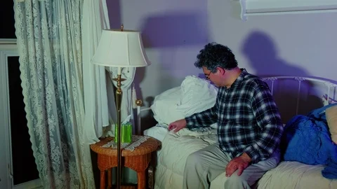 Man looking at bed bugs Stock Footage 95154058