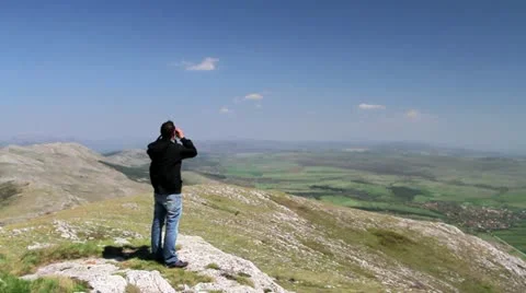 Man looking with binocular Stock Footage 21273523