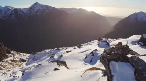 Man looking with binoculars on mountain side. Stock Footage 49832854