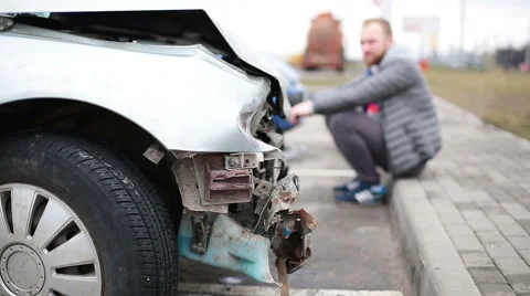 Man looking at broken car after accident Stock Footage 61231883