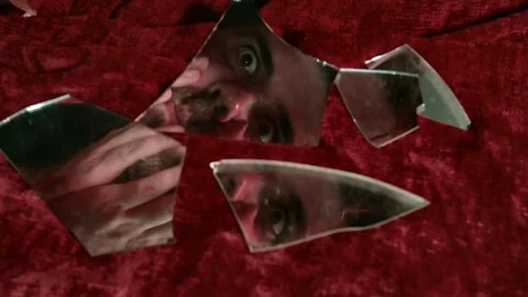 Man looking in broken mirror personality fractured Stock Footage 160177049