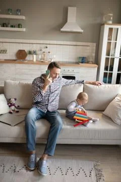 Man looking busy while speaking on the phone Stock Photos