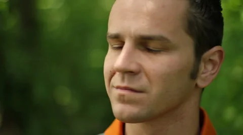 Man looking at camera and smiling outdoors Stock Footage 6101722