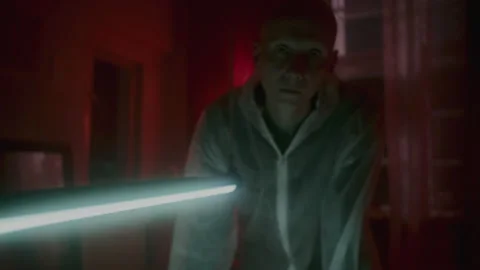 A man looking at the camera in the horror room Video stock 259832684