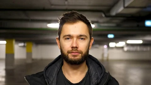 Man looking at camera portrait, Slow Motion, 4k UHD.  Stock Footage 82972013