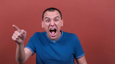 Man Looking at the camera scream and shout. man emotion isolated.  Stock Footage 123017262